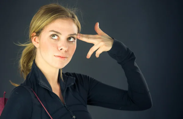 Woman in despair with hand gun