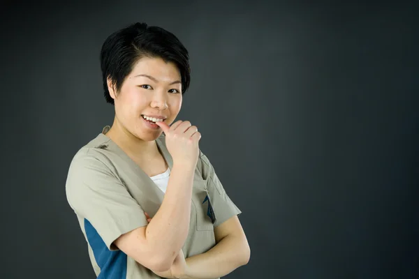 Nervous woman biting finger nails — Stock Photo, Image