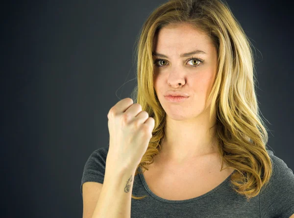 Woman showing her fist — Stock Photo, Image