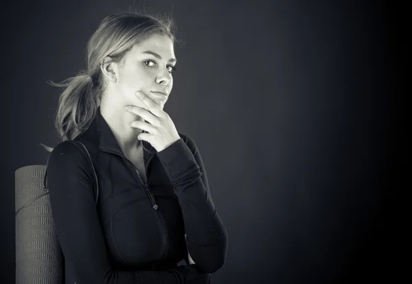Woman thinking with hand on chin — Stock Photo, Image