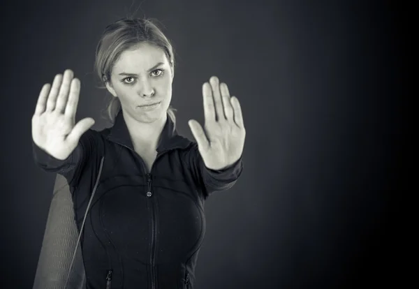 Woman gesturing stop sign with hands