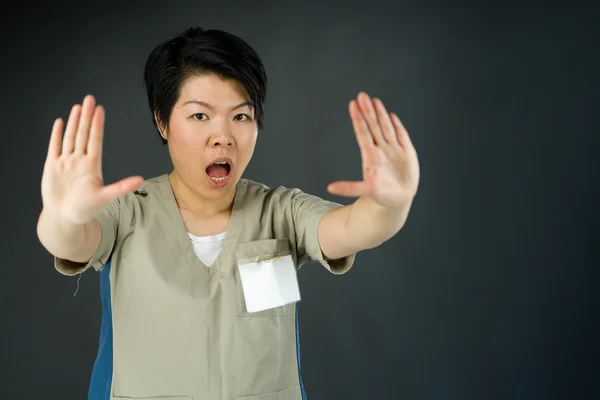 Woman gesturing stop sign with hands — Stock Photo, Image