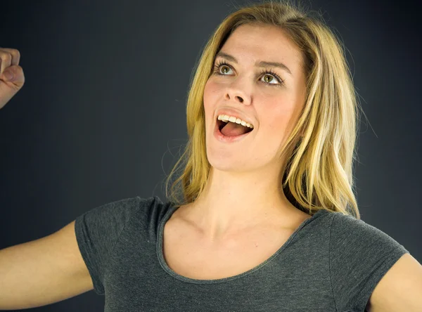 Woman celebrating success with fists up — Stock Photo, Image