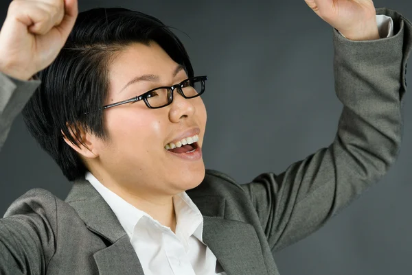 Woman celebrating success with fists up — Stock Photo, Image