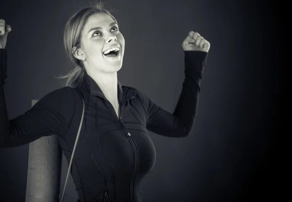 Woman celebrating success with fists up — Stock Photo, Image