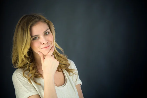 Woman thinking with hand on chin — Stock Photo, Image