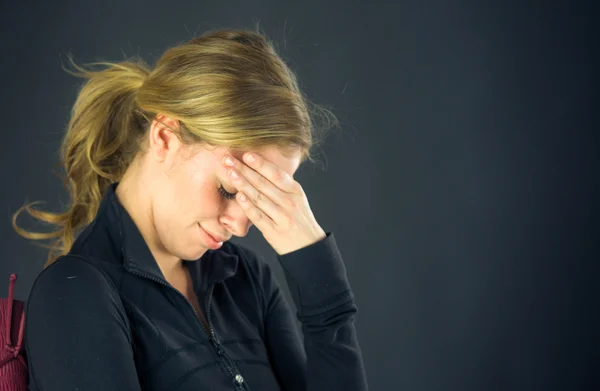 Woman ashamed hiding face in hand — Stock Photo, Image