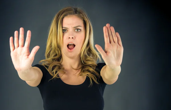 Woman gesturing stop sign with hands — Stock Photo, Image