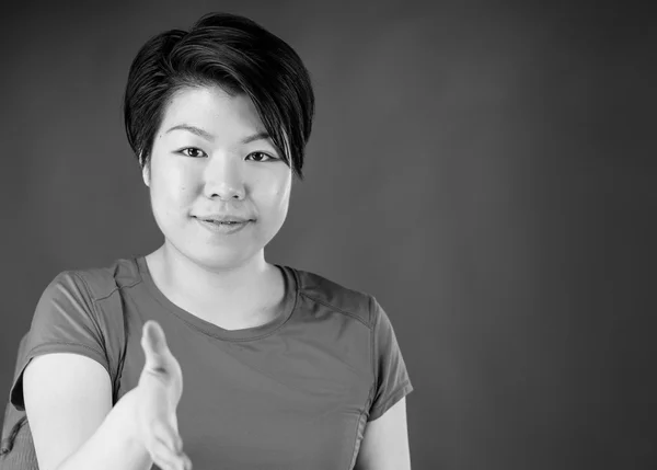 Woman greetings with handshake — Stock Photo, Image