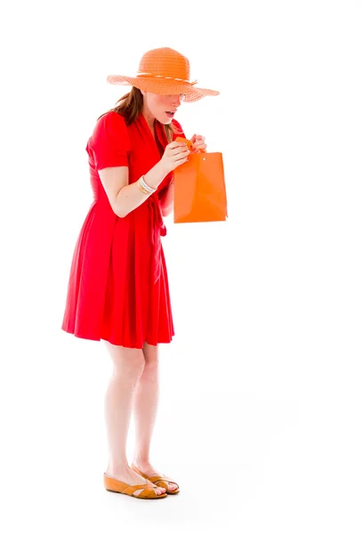 Model looking into shopping bag — Stock Photo, Image