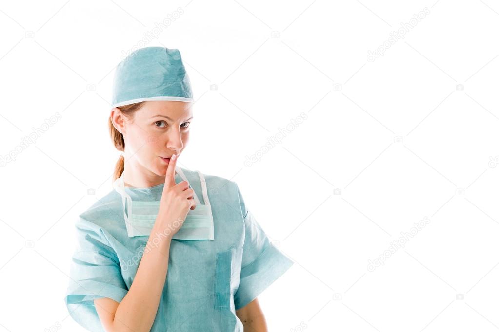 Female doctor with finger on lips