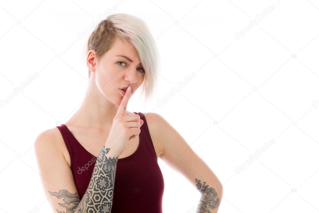 Woman with finger on lips