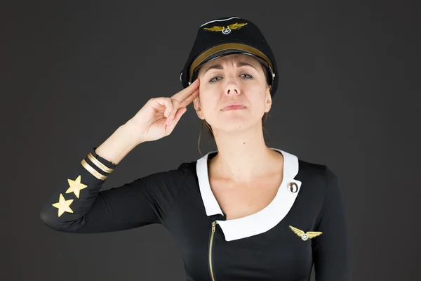 Air hostess with hand gun gesture — Stock Photo, Image