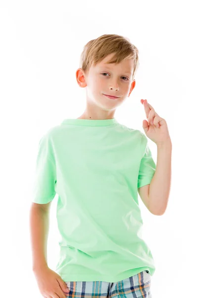 Boy with fingers crossed for luck — Stock Photo, Image