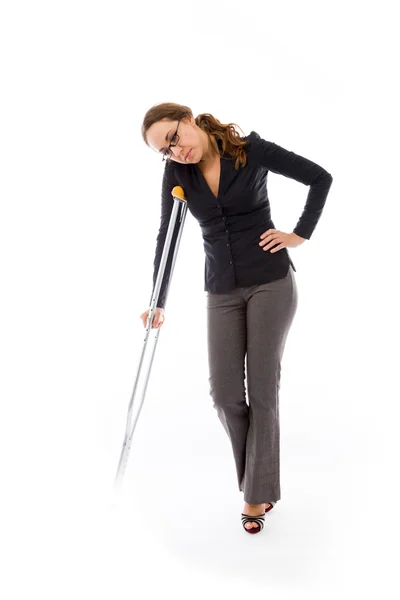 Businesswoman injured with crutch — Stock Photo, Image
