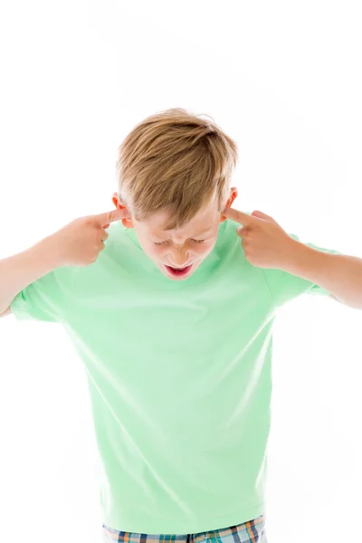 Boy plugging ears with fingers — Stock Photo, Image