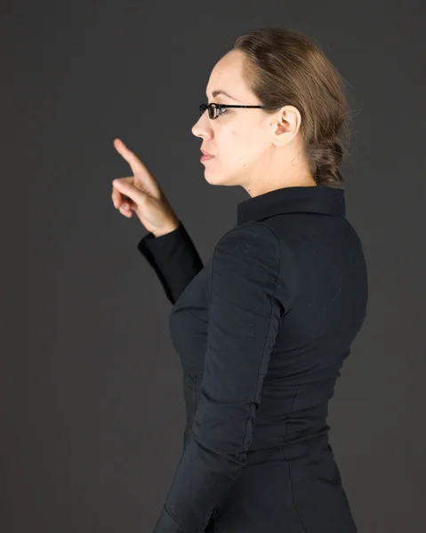 Affärskvinna tillbaka pekar — Stockfoto