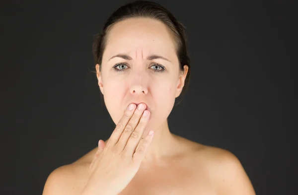 Model covering her mouth — Stock Photo, Image