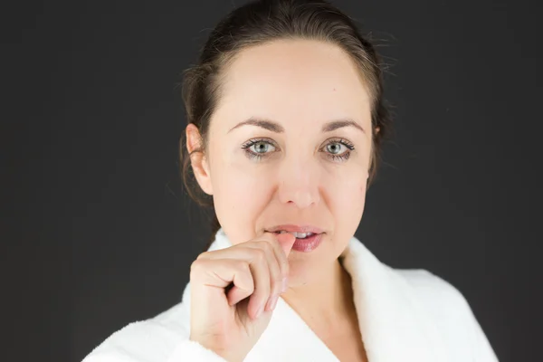 Nervous model biting finger nails — Stock Photo, Image