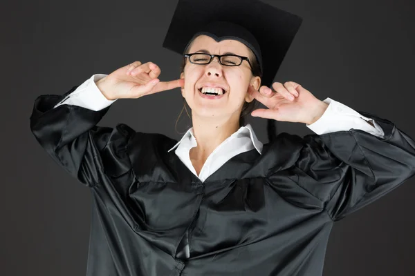 Student plugging ears with fingers — Stock Photo, Image