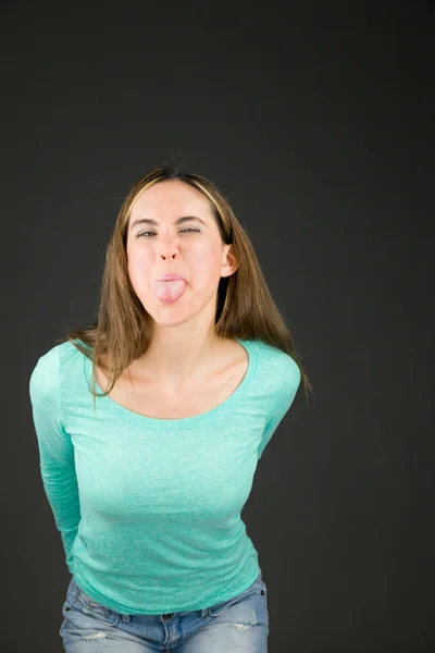 Model sticking tongue out — Stock Photo, Image