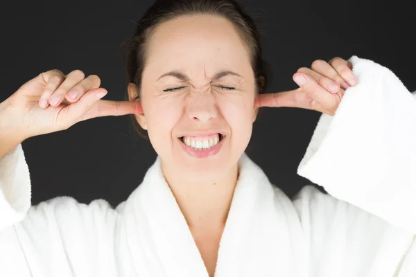 Model plugging ears with fingers — Stock Photo, Image