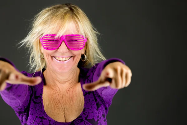 Woman pointing to camera — Stock Photo, Image