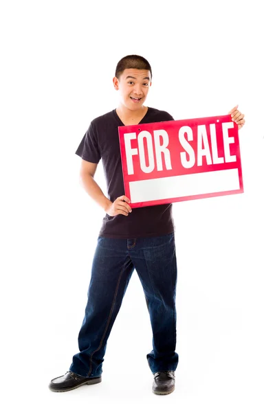 Model holding for sale sign — Stock Photo, Image