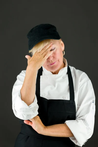 Woman ashamed hiding face in hand — Stock Photo, Image