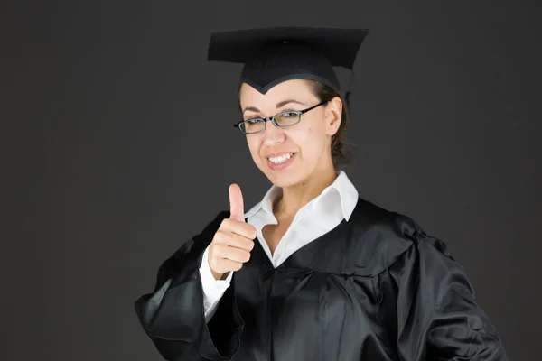 Student gesturing thumb up sign — Stock Photo, Image