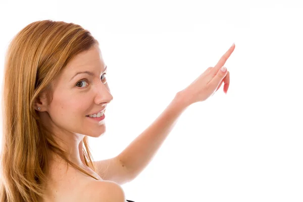 Model looking at camera and pointing — Stock Photo, Image