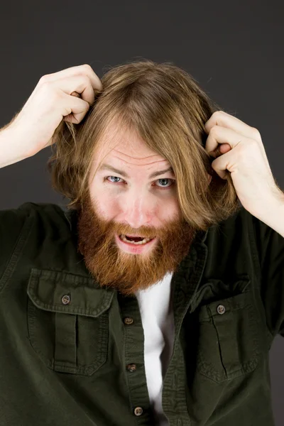 Model stressed and upset pulling hairs — Stock Photo, Image