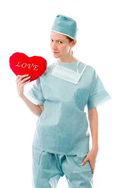 Model with love sign on red pillow — Stock Photo, Image