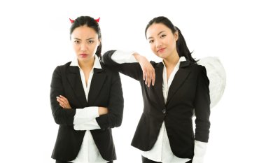 Angel and devil sides of a young Asian businesswoman isolated on white background clipart