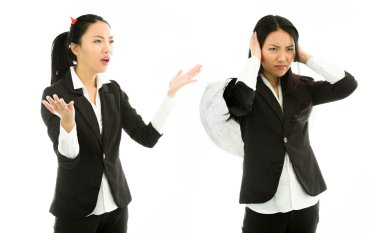 Devil side of a young Asian businesswoman scolding angel side isolated on white background