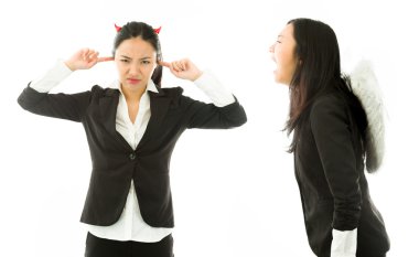Angel side of a young Asian businesswoman shouting over devil side isolated on white background