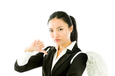 Angel side of a young Asian businesswoman showing thumbs down sign and looking disappointed isolated on white background