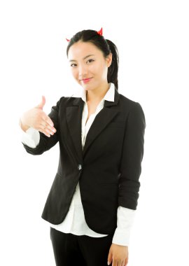Devil side of a young Asian businesswoman offering hand for handshake isolated on white background