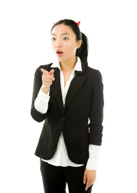 Devil side of a young Asian businesswoman pointing forward and looking shocked isolated on white background