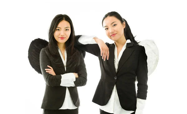 Múltipla imagem representando dois lados de anjo diferentes de uma jovem empresária asiática isolada no fundo branco — Fotografia de Stock