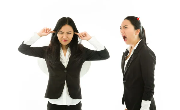 Devil side of a young Asian businesswoman shouting over angel side isolated on white background — Stock Photo, Image