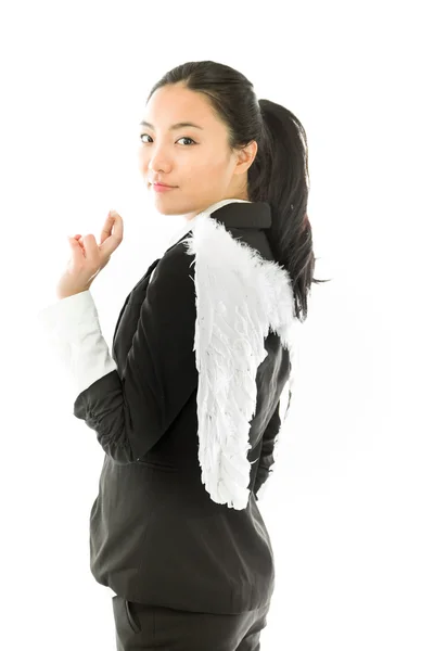 Asian young businesswoman dressed as white angel standing with her fingers crossed isolated on white background — ストック写真