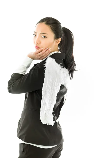 Asiático jovem empresária vestida como anjo branco com a mão no queixo e olhando entediado isolado no fundo branco — Fotografia de Stock
