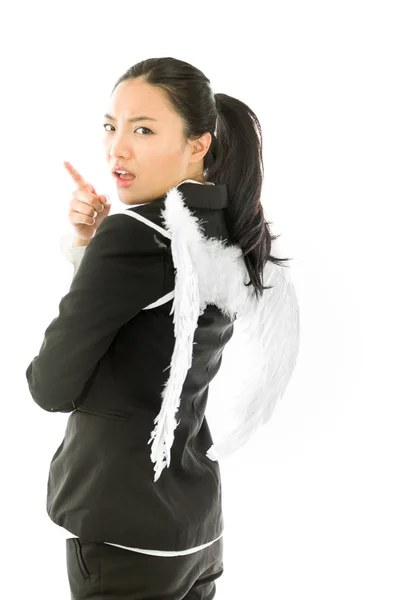 Angel side of a young Asian businesswoman scolding someone isolated on white background — ストック写真