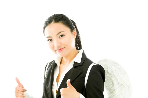 Asiática joven empresaria vestida como ángel blanco haciendo pulgares hacia arriba signo con ambas manos aisladas sobre fondo blanco — Foto de Stock