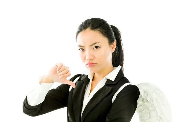 Ángel lado de una joven mujer de negocios asiática mostrando los pulgares hacia abajo signo y mirando decepcionado aislado sobre fondo blanco — Foto de Stock