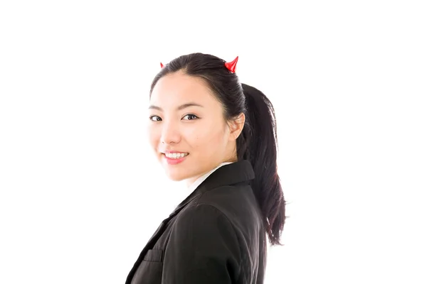 Devil side of a young Asian businesswoman smiling isolated on white background — Zdjęcie stockowe