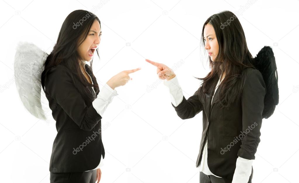 Different angel sides of a young Asian businesswoman having argument with each other isolated on white background