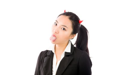 Devil side of a young Asian businesswoman sticking out her tongue isolated on white background