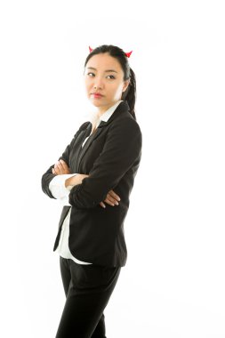 Devil side of a young Asian businesswoman standing with arms crossed and thinking isolated on white background